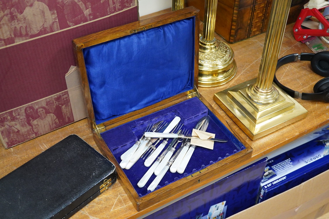 A quantity of assorted plated items including entrée dishes, flatware and mugs.